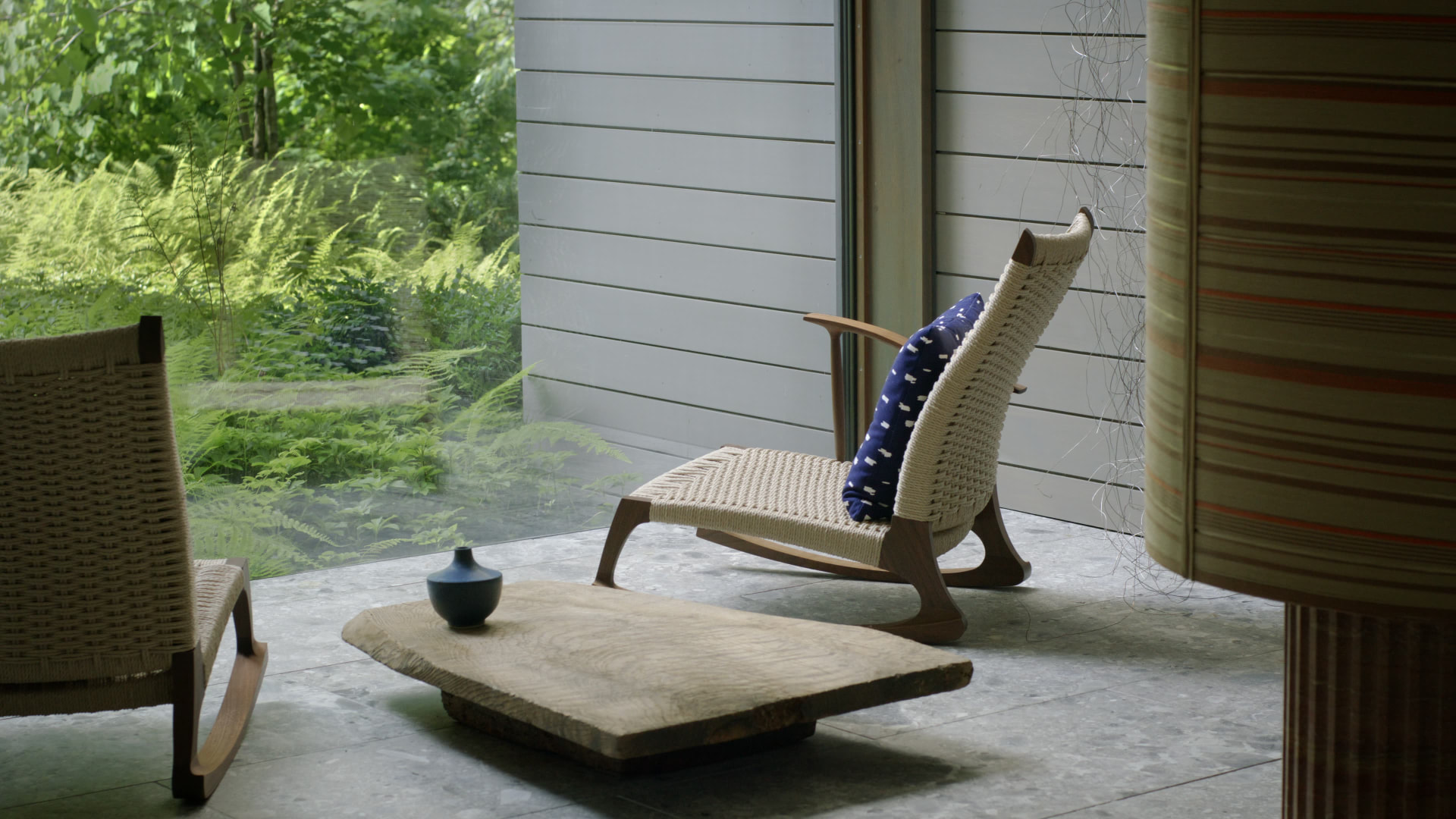 Bedford Quarry — Woven rocking chair beside a low timber table by the window
