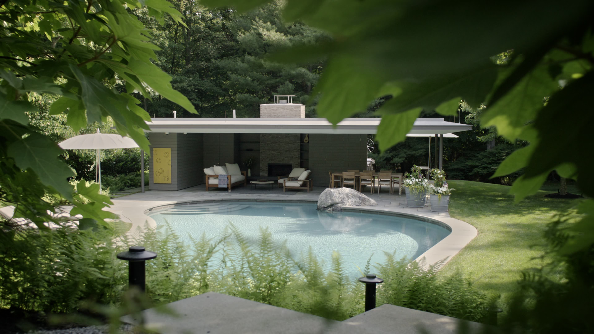 Bedford Quarry — Covered pavilion beside the pool with a large grey boulder