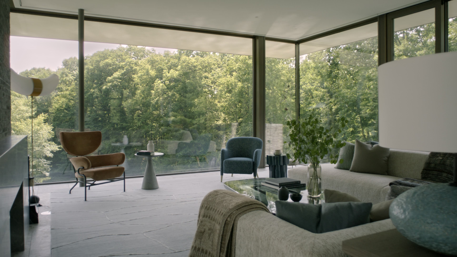 Bedford Quarry — Corner living room glazed to the treetops with a tan lounge chair