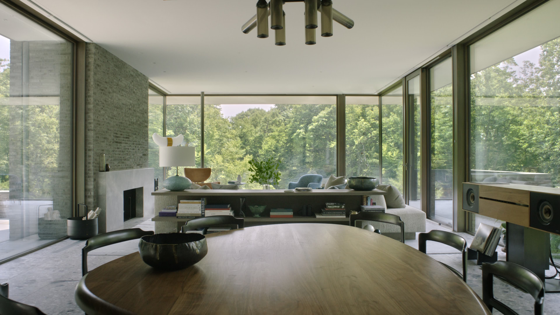 Bedford Quarry — Living and dining area with floor-to-ceiling windows to the forest